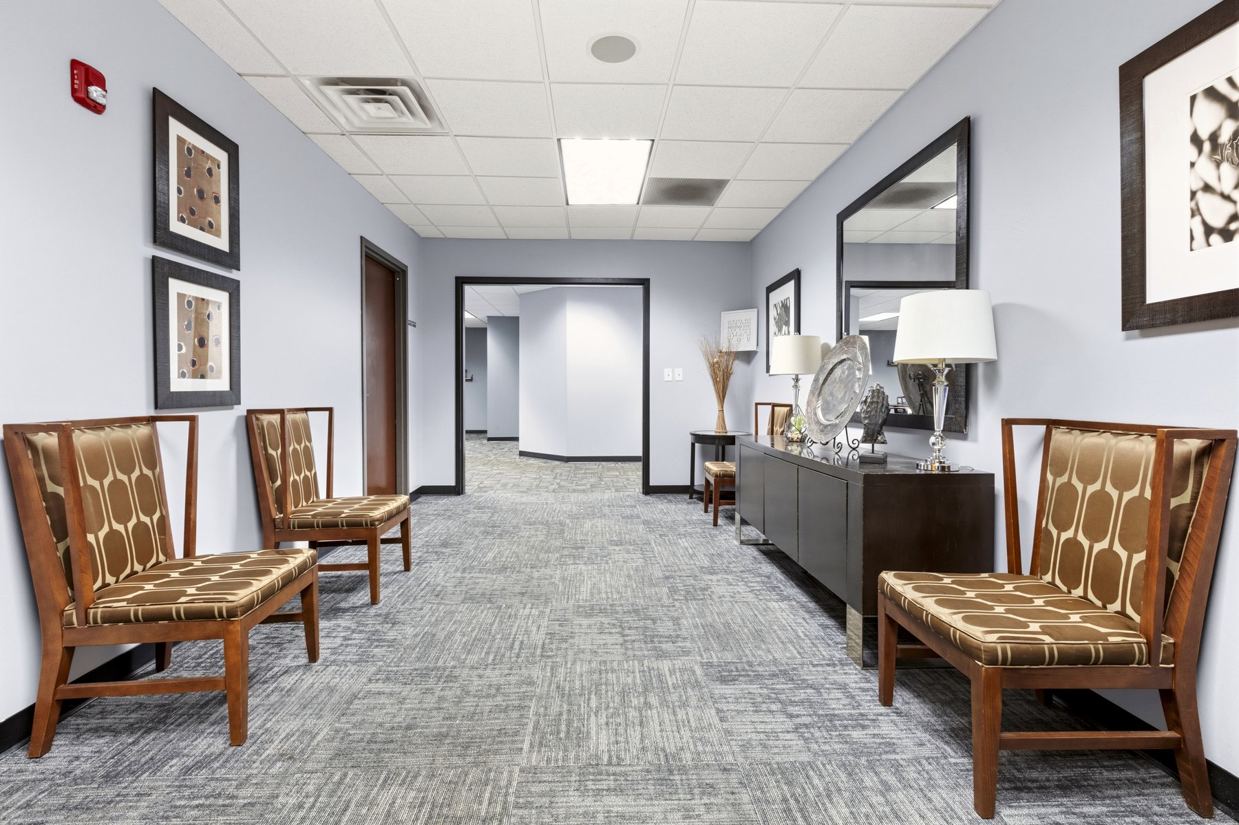 Common hallway at Roswell Office Suites with seating and decor