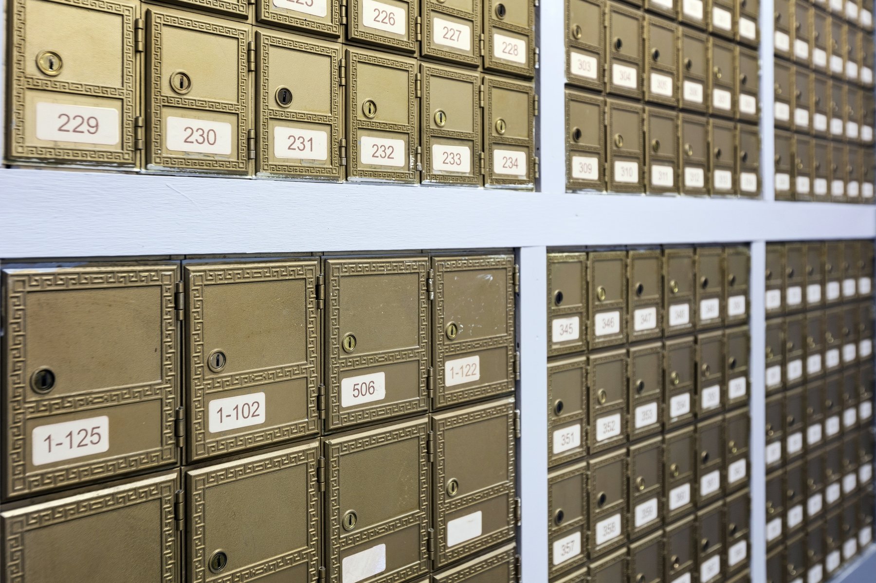Close-up of tenant mailboxes at Roswell Office Suites showing the business address setup