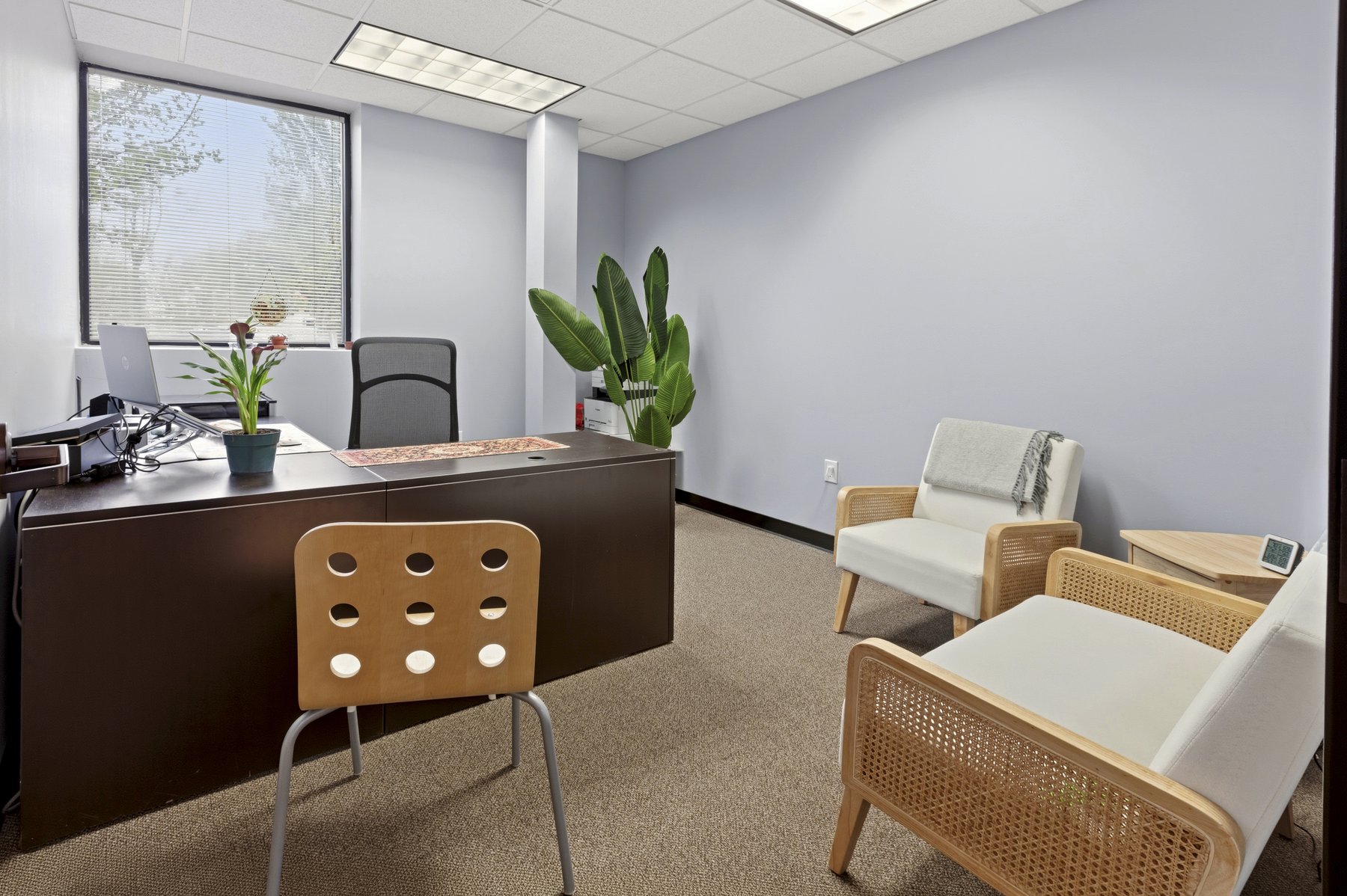 Styled private office at Roswell Office Suites, a different view showing the workspace setup